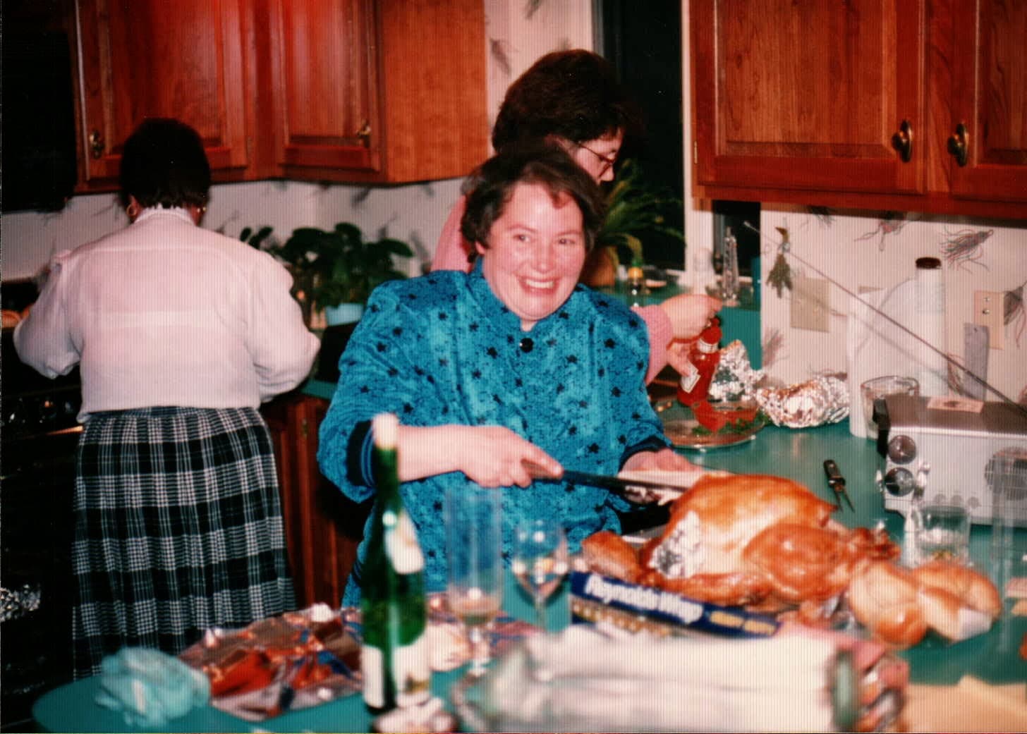Nancy, Laura, and Annie in the Quinn kitchen on Thanksgiving, 1980s.